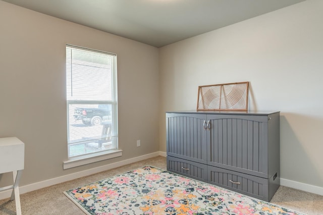 bedroom with light carpet