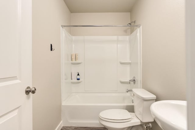 full bathroom with sink, toilet, and washtub / shower combination