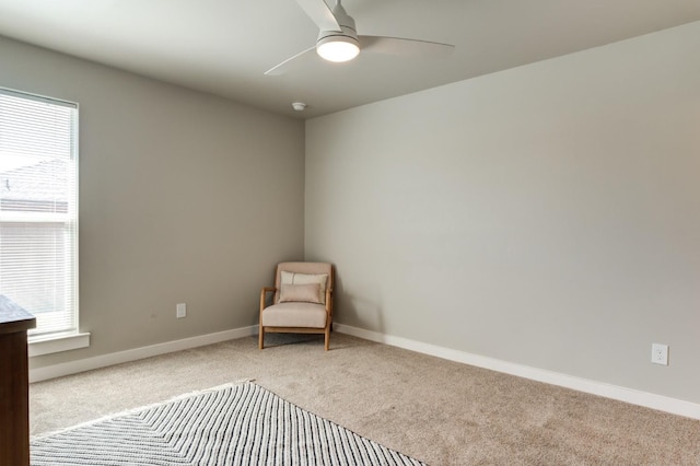 unfurnished room with light colored carpet and ceiling fan