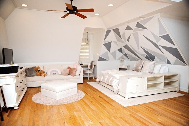 bedroom with lofted ceiling and light hardwood / wood-style floors