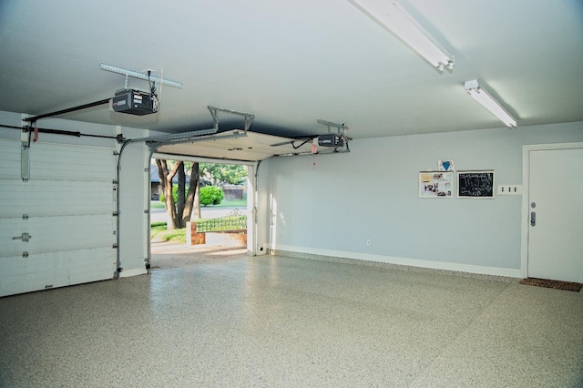 garage featuring a garage door opener