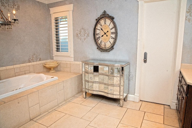 bathroom featuring vanity, a relaxing tiled tub, and tile patterned floors