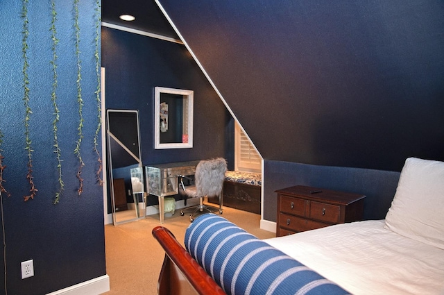 carpeted bedroom with lofted ceiling