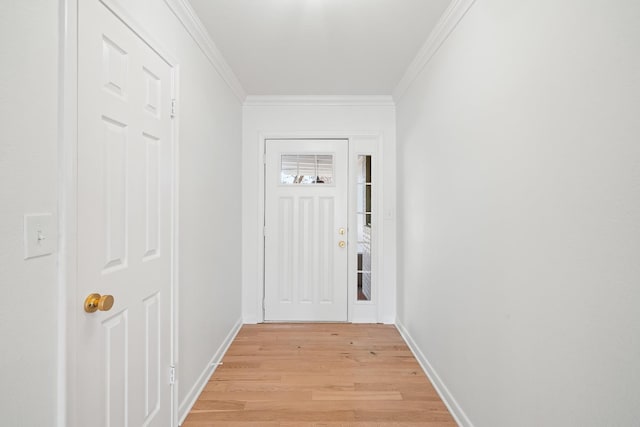 doorway to outside with crown molding and light wood-type flooring