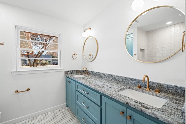 bathroom featuring tile patterned flooring and vanity