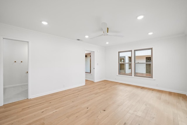 unfurnished room with crown molding, ceiling fan, and light hardwood / wood-style floors