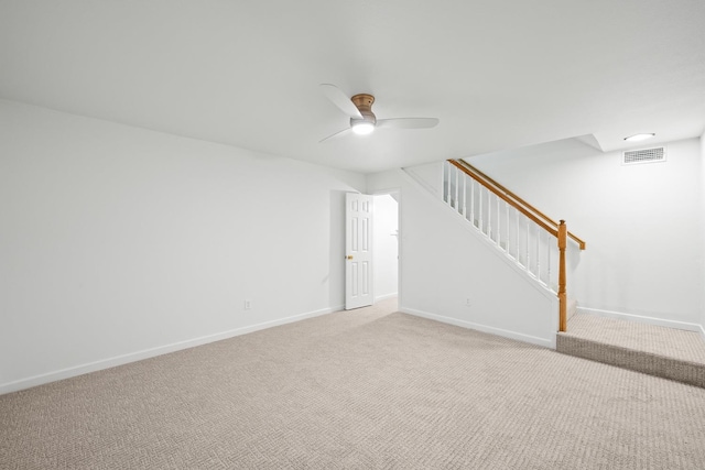 unfurnished room featuring light colored carpet and ceiling fan