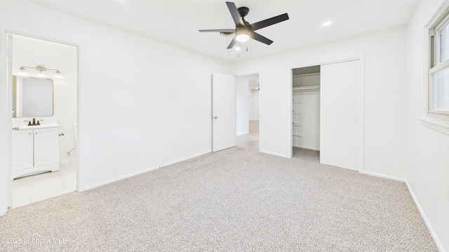 3811 42nd St, Lubbock, TX 79413 - unfurnished bedroom featuring light colored carpet, a closet, ensuite bathroom, and a ceiling fan