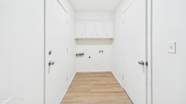 3811 42nd St, Lubbock, TX 79413 - washroom featuring electric dryer hookup, hookup for a washing machine, cabinet space, and light wood-type flooring