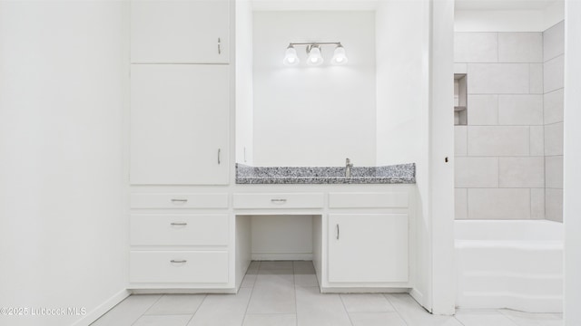 3811 42nd St, Lubbock, TX 79413 - full bathroom with vanity, tile patterned flooring, and tub / shower combination