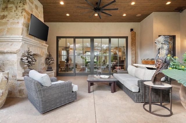 living room with wooden ceiling, ceiling fan, and concrete floors