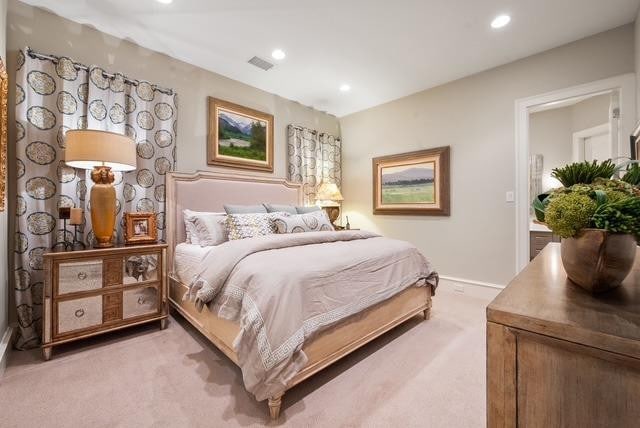 bedroom featuring light colored carpet