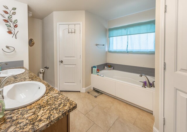 bathroom with vanity and a tub to relax in