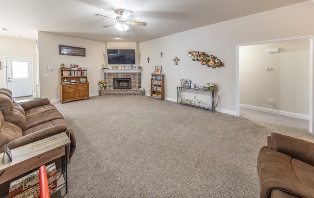 living room featuring ceiling fan, a fireplace, and carpet