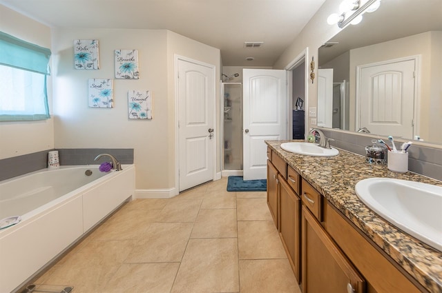 bathroom with vanity and a washtub