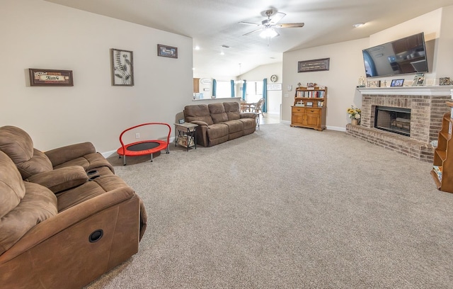 carpeted living room with lofted ceiling, a fireplace, and ceiling fan