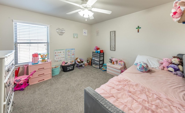 bedroom featuring ceiling fan and carpet