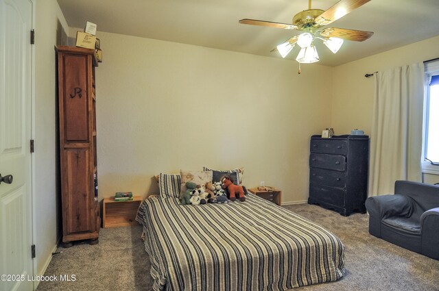 5309 77th St, Lubbock, TX 79424 - carpeted bedroom featuring a ceiling fan and baseboards
