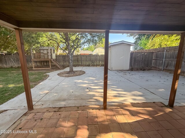 5309 77th St, Lubbock, TX 79424 - fenced backyard with a patio area