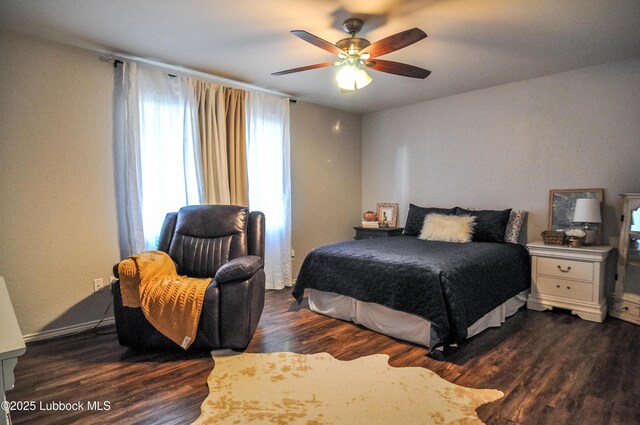 5309 77th St, Lubbock, TX 79424 - bedroom featuring dark wood finished floors and ceiling fan