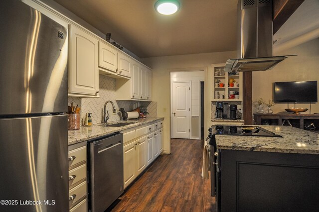 5309 77th St, Lubbock, TX 79424 - kitchen featuring freestanding refrigerator, dishwashing machine, island exhaust hood, a sink, and decorative backsplash