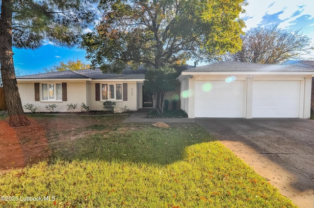 5309 77th St, Lubbock, TX 79424 - ranch-style home featuring driveway, a garage, brick siding, and a front yard