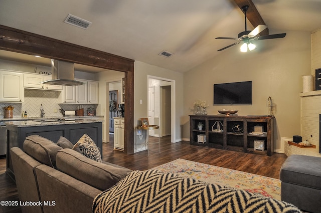 5309 77th St, Lubbock, TX 79424 - living area featuring ceiling fan, dark wood-type flooring, baseboards, and a fireplace