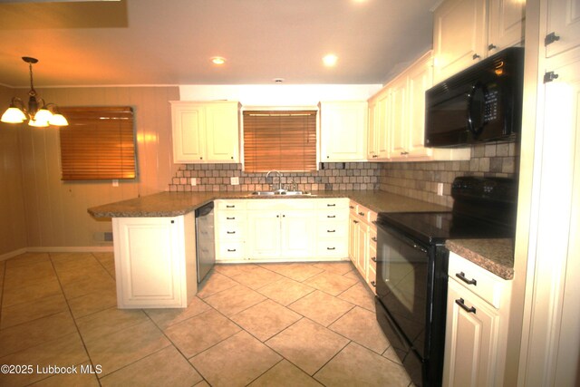 3707 38th St, Lubbock, TX 79413 - kitchen featuring black appliances, a peninsula, dark countertops, decorative backsplash, and recessed lighting