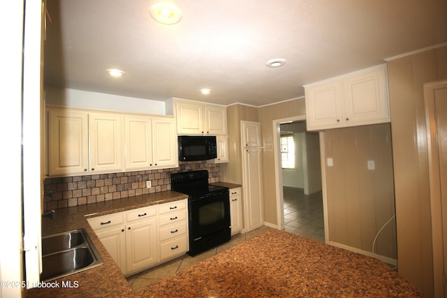 3707 38th St, Lubbock, TX 79413 - kitchen featuring black appliances, dark countertops, light tile patterned floors, decorative backsplash, and recessed lighting