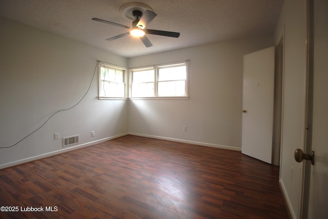 3707 38th St, Lubbock, TX 79413 - empty room with a ceiling fan, dark wood-type flooring, and a textured ceiling