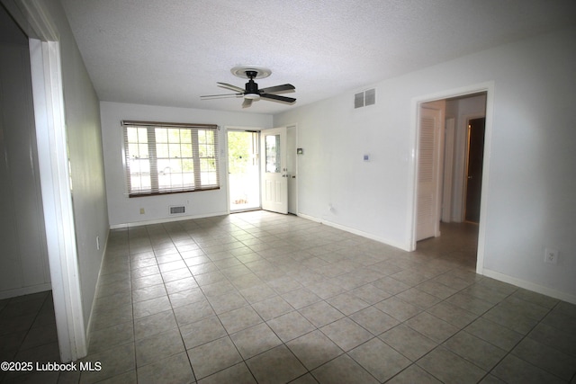 3707 38th St, Lubbock, TX 79413 - tiled spare room with ceiling fan and a textured ceiling