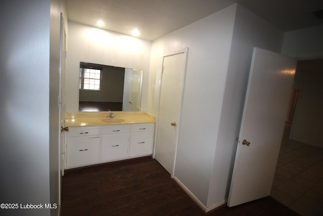 3707 38th St, Lubbock, TX 79413 - bathroom with vanity and hardwood / wood-style flooring