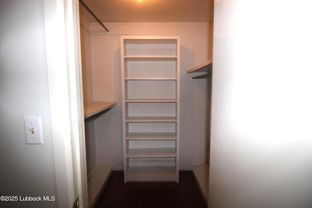 3707 38th St, Lubbock, TX 79413 - walk in closet featuring dark wood-style flooring