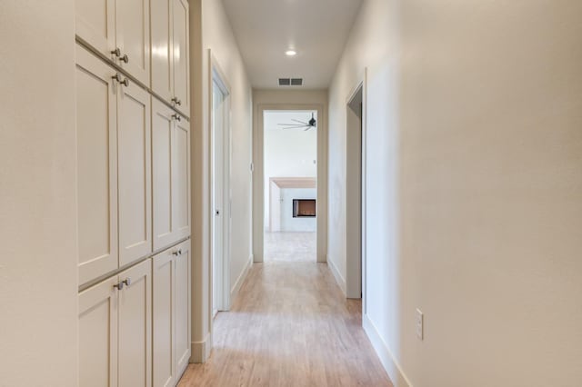 corridor featuring light hardwood / wood-style flooring