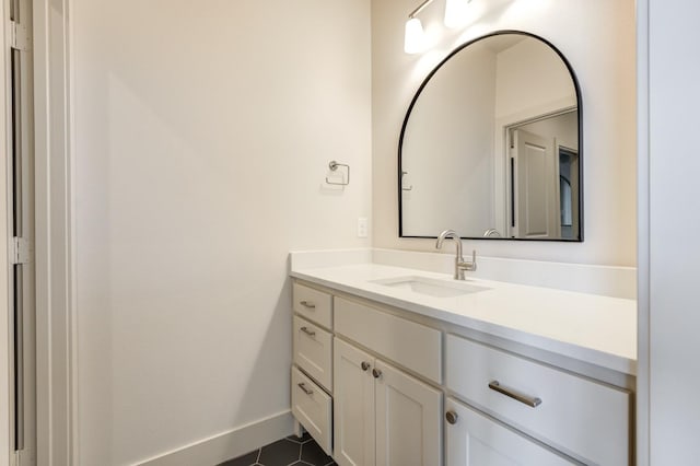 bathroom with vanity and tile patterned flooring