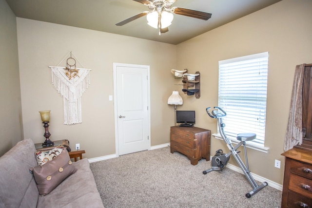workout area with ceiling fan, carpet flooring, and baseboards