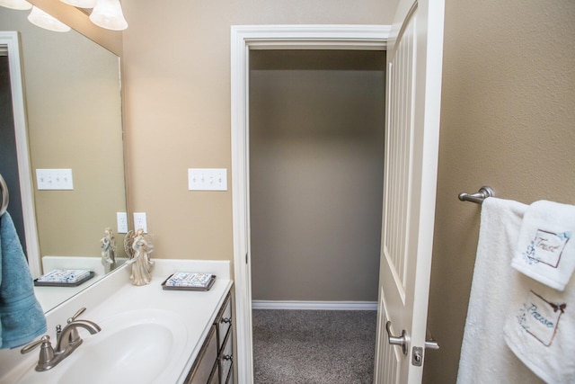 bathroom featuring vanity and baseboards