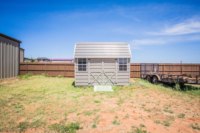 view of shed featuring a fenced backyard