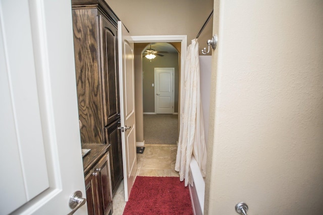 full bath with tile patterned floors and a ceiling fan