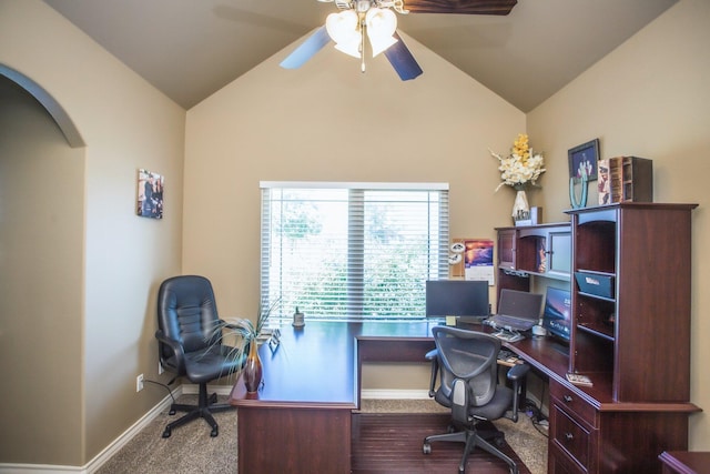 office space featuring arched walkways, baseboards, a ceiling fan, and high vaulted ceiling