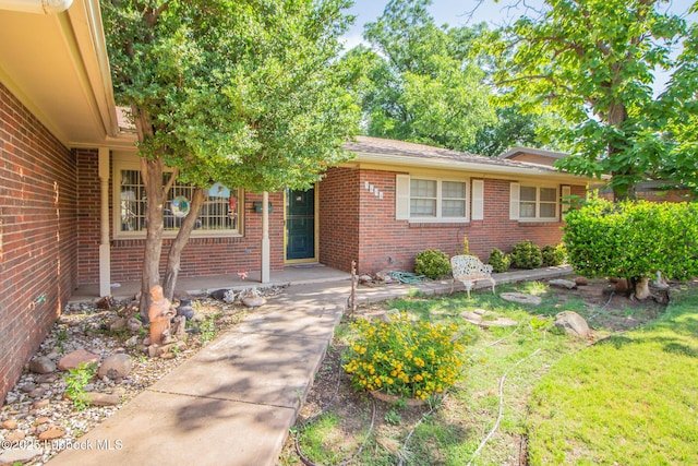 3404 59th St, Lubbock, TX 79413 - property entrance featuring brick siding