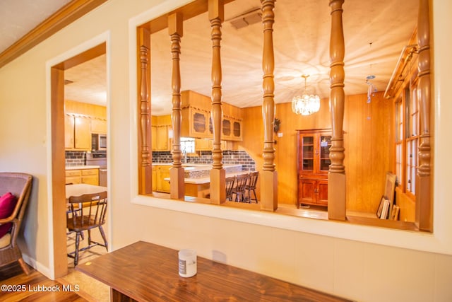 3404 59th St, Lubbock, TX 79413 - dining room featuring wood finished floors and a chandelier
