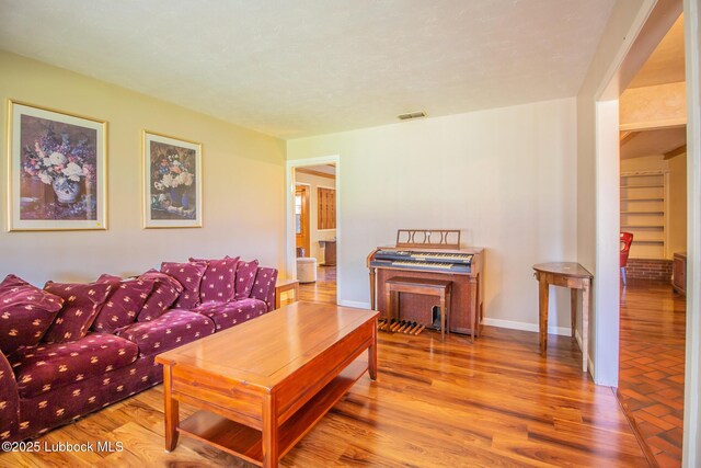 3404 59th St, Lubbock, TX 79413 - living area with wood finished floors and baseboards
