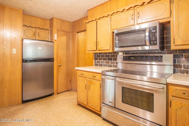 3404 59th St, Lubbock, TX 79413 - kitchen with stainless steel appliances, tasteful backsplash, and light countertops