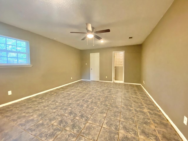 unfurnished room with ceiling fan