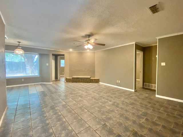 unfurnished living room with ceiling fan, a textured ceiling, and ornamental molding