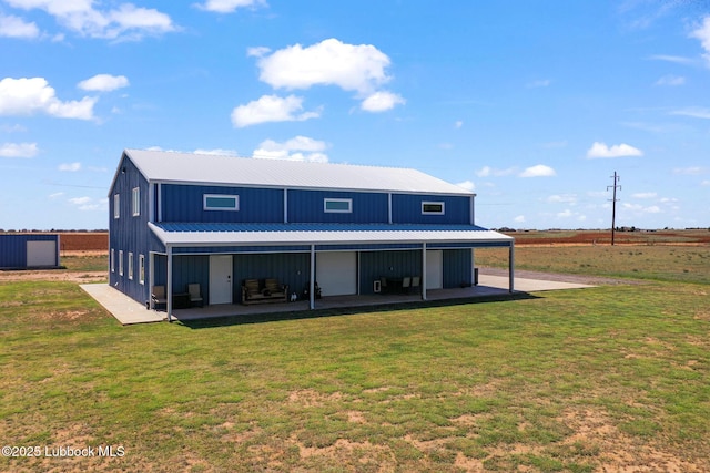 743 Co Rd, M, Tahoka, TX 79373 - rear view of house featuring a yard, metal roof, and board and batten siding