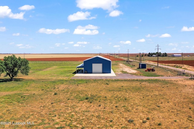 743 Co Rd, M, Tahoka, TX 79373 - view of yard featuring a pole building, an outdoor structure, and a garage