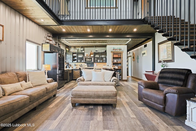 743 Co Rd, M, Tahoka, TX 79373 - living area with wood finished floors, stairway, and recessed lighting