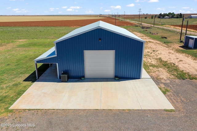 743 Co Rd, M, Tahoka, TX 79373 - view of outbuilding featuring central air condition unit and a rural view